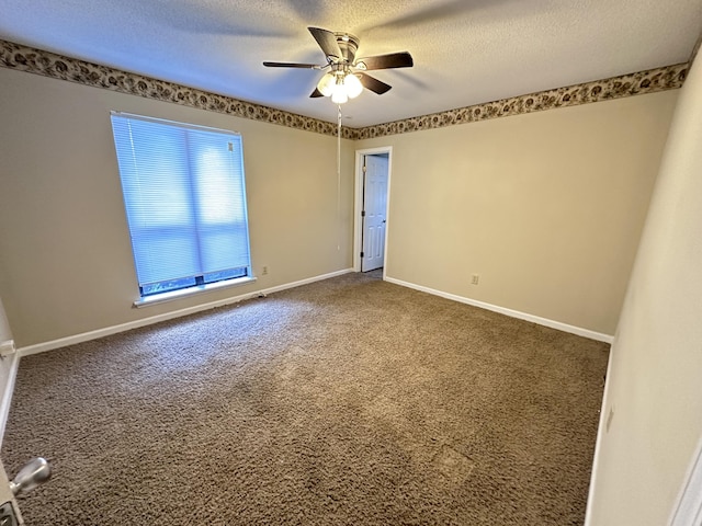 empty room featuring carpet, ceiling fan, and a textured ceiling