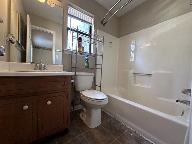 full bathroom with tile patterned floors, vanity,  shower combination, and toilet