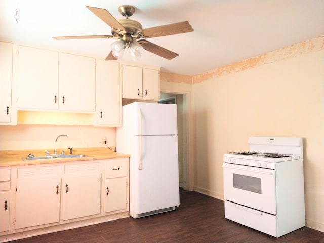 2232 Bandler Rd, Augusta, GA 30906 - kitchen with white appliances, a sink, dark wood-style floors, light countertops, and white cabinetry