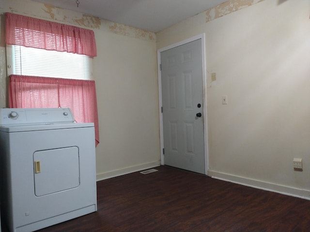 clothes washing area featuring washer / dryer and dark hardwood / wood-style floors