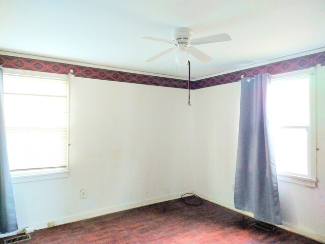 2232 Bandler Rd, Augusta, GA 30906 - unfurnished room featuring a ceiling fan, dark wood-style flooring, and baseboards