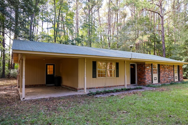 ranch-style home featuring a carport