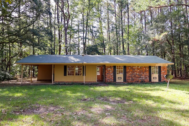 single story home with a front lawn and a carport