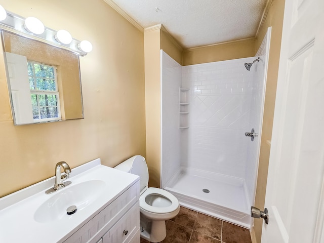 bathroom featuring vanity, a textured ceiling, toilet, and walk in shower