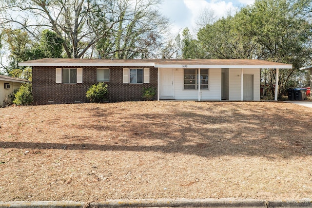 ranch-style house with a carport