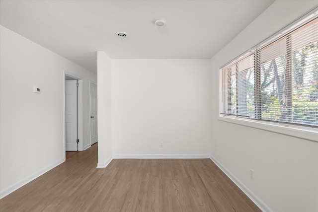 spare room featuring hardwood / wood-style flooring