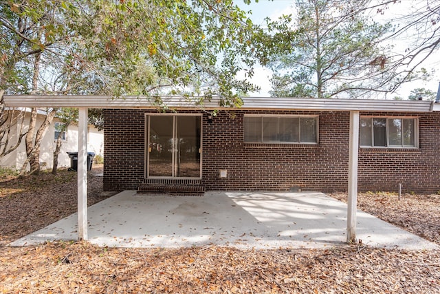 rear view of property featuring a patio area