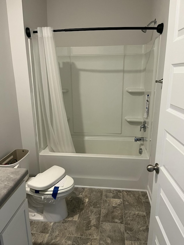 full bathroom with shower / bathtub combination with curtain, vanity, and toilet