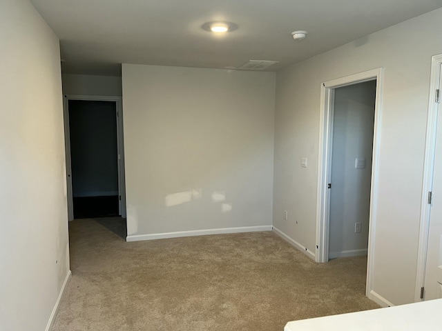 spare room with light carpet