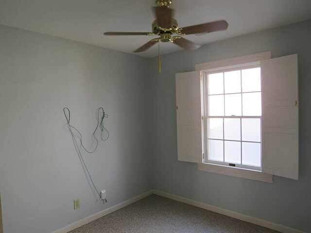 spare room featuring ceiling fan