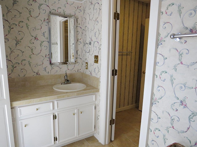 bathroom featuring tile patterned flooring and vanity