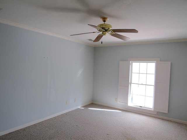 carpeted empty room featuring crown molding and ceiling fan