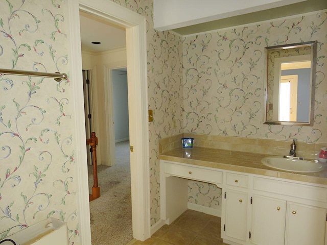 bathroom featuring vanity, tile patterned flooring, and crown molding