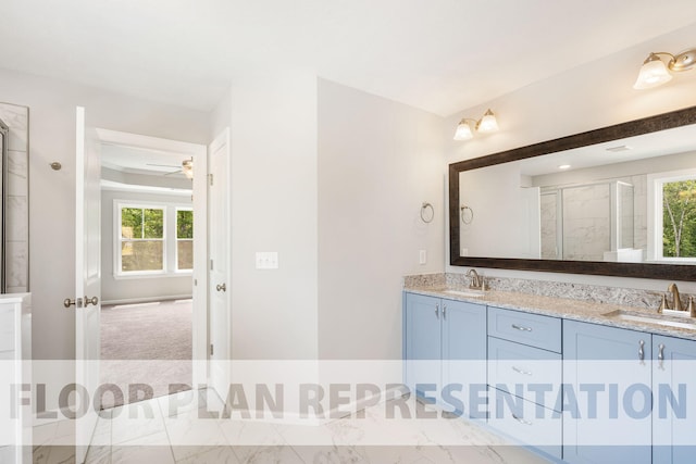 bathroom featuring ceiling fan, walk in shower, and vanity