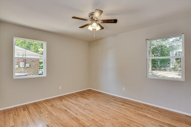 unfurnished room featuring ceiling fan and light hardwood / wood-style flooring