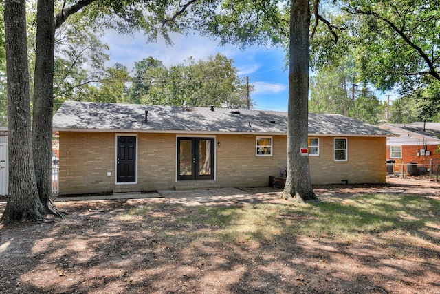 rear view of property featuring french doors