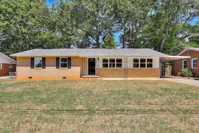 ranch-style home featuring a carport and a front yard