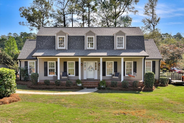 cape cod-style house with a front yard