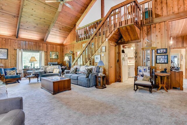 889 Woodhaven St, North, SC 29112 - living room featuring high vaulted ceiling, wooden walls, carpet floors, stairway, and a wooden ceiling with exposed beams