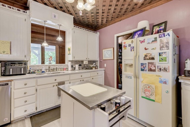 889 Woodhaven St, North, SC 29112 - kitchen featuring white fridge with ice dispenser, stainless steel dishwasher, white cabinetry, tasteful backsplash, and ornamental molding