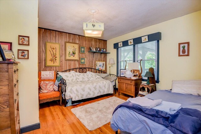 889 Woodhaven St, North, SC 29112 - bedroom featuring light wood-type flooring and wood walls