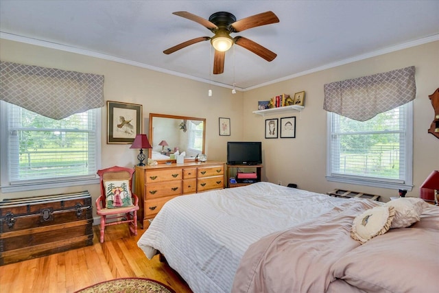 889 Woodhaven St, North, SC 29112 - bedroom with wood finished floors, multiple windows, crown molding, and a ceiling fan