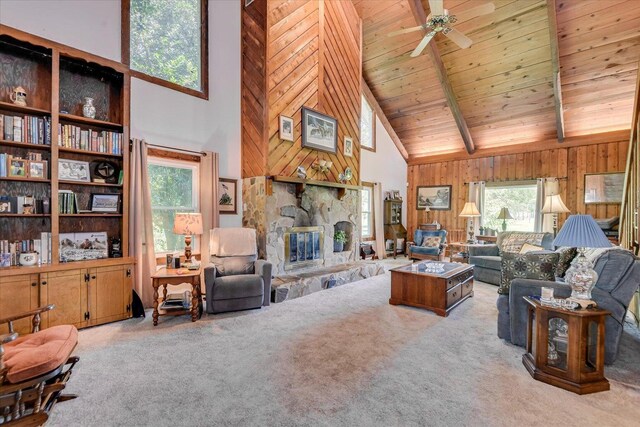889 Woodhaven St, North, SC 29112 - carpeted living room featuring high vaulted ceiling, a ceiling fan, wood walls, a fireplace, and a wood ceiling with exposed beams