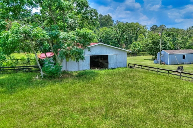 889 Woodhaven St, North, SC 29112 - view of pole building featuring a wooded view