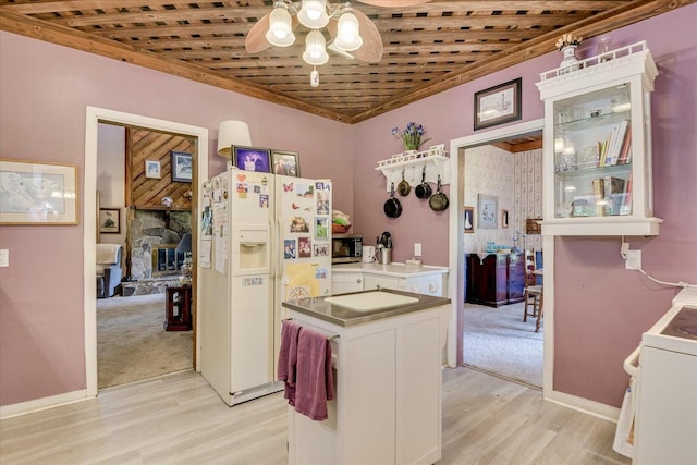 889 Woodhaven St, North, SC 29112 - kitchen featuring white refrigerator with ice dispenser, stove, a ceiling fan, and light wood-type flooring