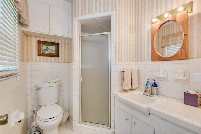 889 Woodhaven St, North, SC 29112 - full bathroom with wallpapered walls, tile walls, vanity, a stall shower, and wainscoting