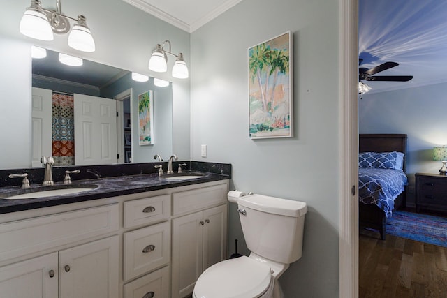 3507 Lost Tree Ln, Martinez, GA 30907 - ensuite bathroom featuring double vanity, crown molding, wood finished floors, toilet, and ceiling fan