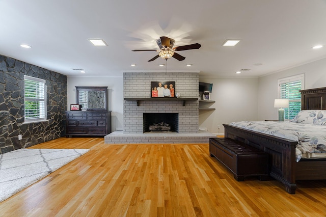 3507 Lost Tree Ln, Martinez, GA 30907 - bedroom with wood finished floors, multiple windows, ornamental molding, a fireplace, and a ceiling fan