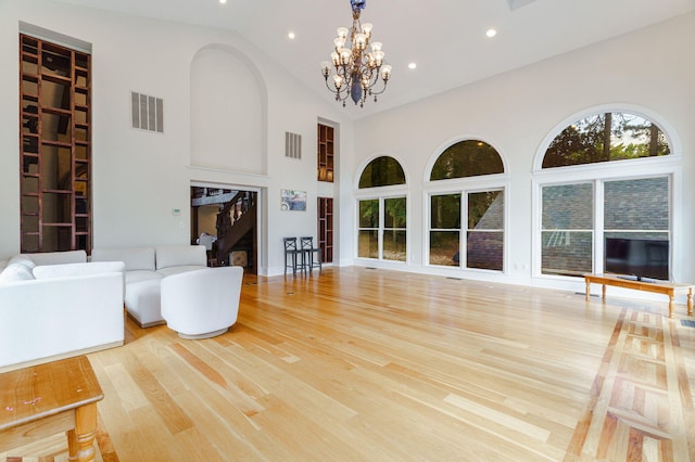 3507 Lost Tree Ln, Martinez, GA 30907 - unfurnished living room featuring high vaulted ceiling, a chandelier, wood finished floors, and recessed lighting