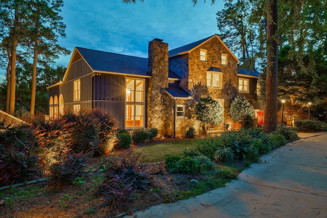 3507 Lost Tree Ln, Martinez, GA 30907 - view of front facade featuring stone siding, a chimney, and board and batten siding