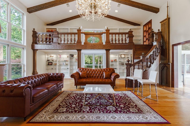 3507 Lost Tree Ln, Martinez, GA 30907 - living area featuring high vaulted ceiling, wood finished floors, a chandelier, plenty of natural light, and beam ceiling