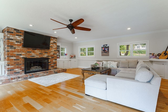 3507 Lost Tree Ln, Martinez, GA 30907 - living room featuring crown molding, a ceiling fan, wood finished floors, a brick fireplace, and recessed lighting