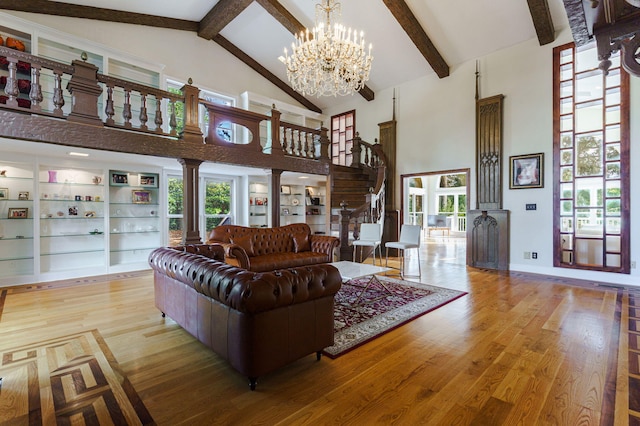3507 Lost Tree Ln, Martinez, GA 30907 - living area featuring high vaulted ceiling, wood finished floors, beamed ceiling, decorative columns, and a chandelier