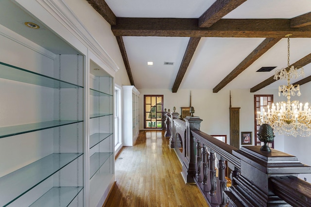 3507 Lost Tree Ln, Martinez, GA 30907 - hall with healthy amount of natural light, beamed ceiling, an upstairs landing, a chandelier, and wood finished floors