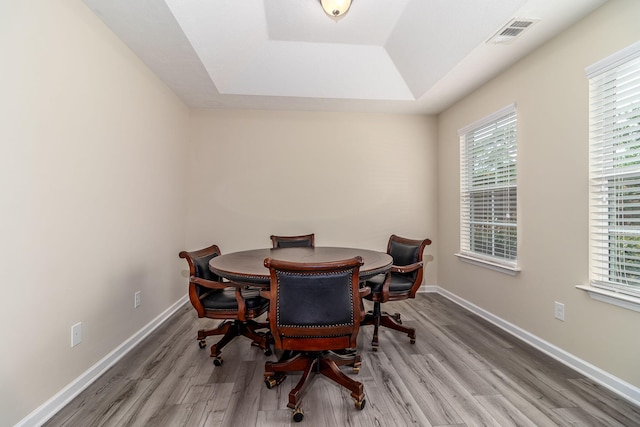 2697 York Dr, Augusta, GA 30909 - dining room with wood finished floors, a tray ceiling, and baseboards