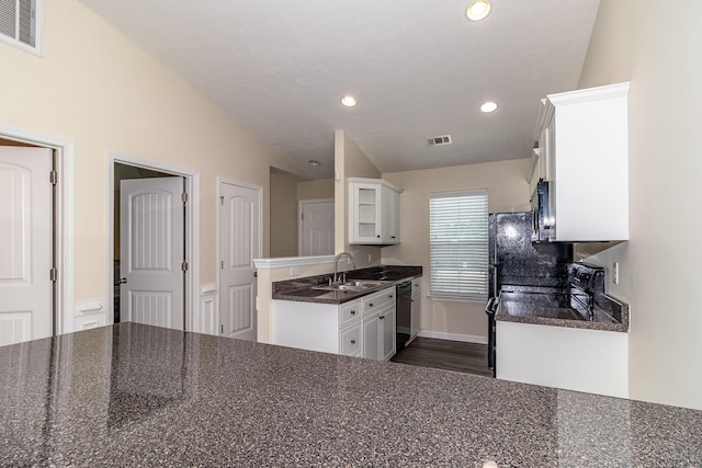 2697 York Dr, Augusta, GA 30909 - kitchen featuring dark countertops, dishwasher, white cabinets, a sink, and glass insert cabinets