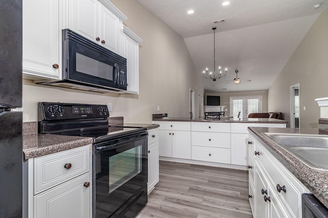 2697 York Dr, Augusta, GA 30909 - kitchen featuring black appliances, lofted ceiling, a chandelier, dark countertops, and open floor plan