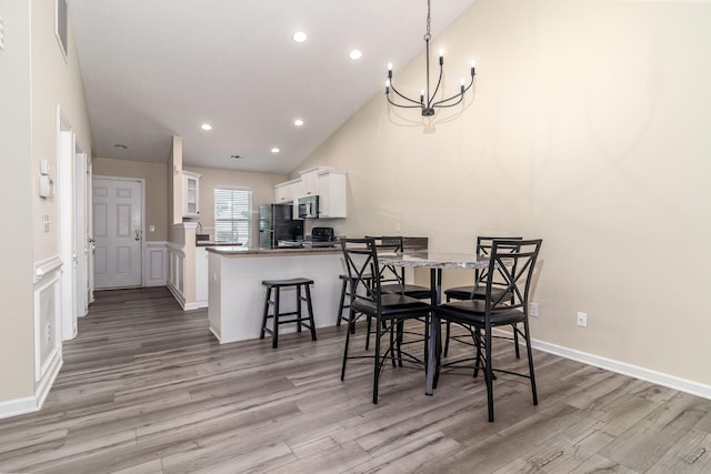 2697 York Dr, Augusta, GA 30909 - dining space with light wood finished floors, a chandelier, recessed lighting, and baseboards