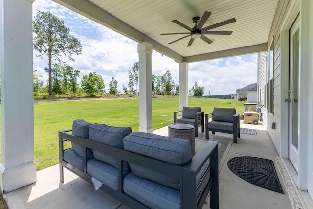 view of patio with an outdoor living space and a ceiling fan