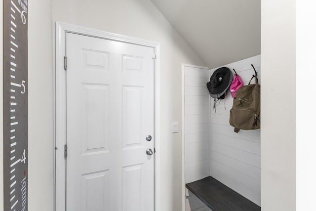 mudroom featuring lofted ceiling