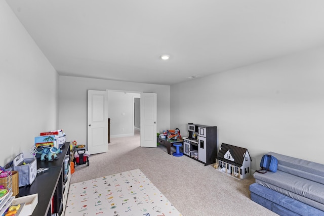 rec room with carpet and recessed lighting
