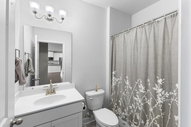 bathroom with vanity, toilet, and a shower with curtain
