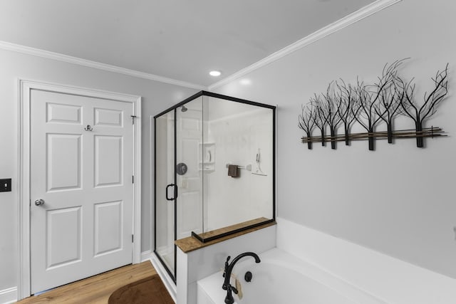 165 Indian Valley Ln, Swansea, SC 29160 - bathroom featuring ornamental molding, a shower stall, a garden tub, wood finished floors, and recessed lighting