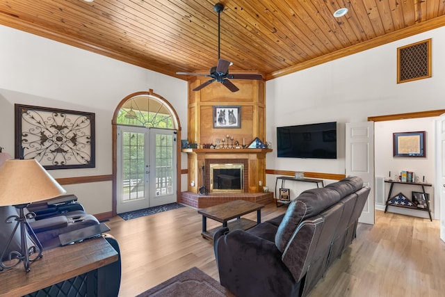 165 Indian Valley Ln, Swansea, SC 29160 - living room with ornamental molding, wooden ceiling, ceiling fan, wood finished floors, and a brick fireplace