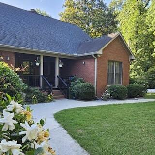 165 Indian Valley Ln, Swansea, SC 29160 - view of front facade with brick siding, a front lawn, and roof with shingles