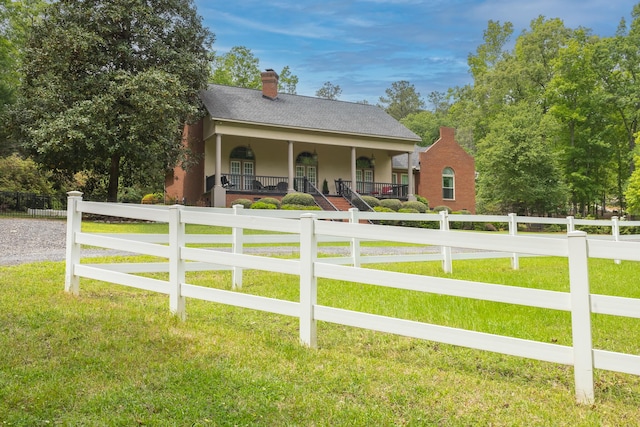 165 Indian Valley Ln, Swansea, SC 29160 - view of front of property with covered porch, stucco siding, and a chimney